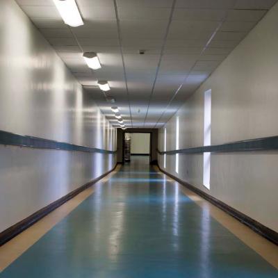 The view down a long hospital corridor