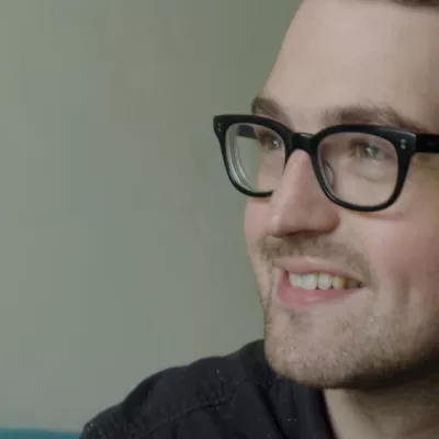 Smiling man wearing glasses