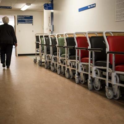 line of wheelchairs in a hospital