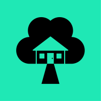 Black house and tree icon on a green background